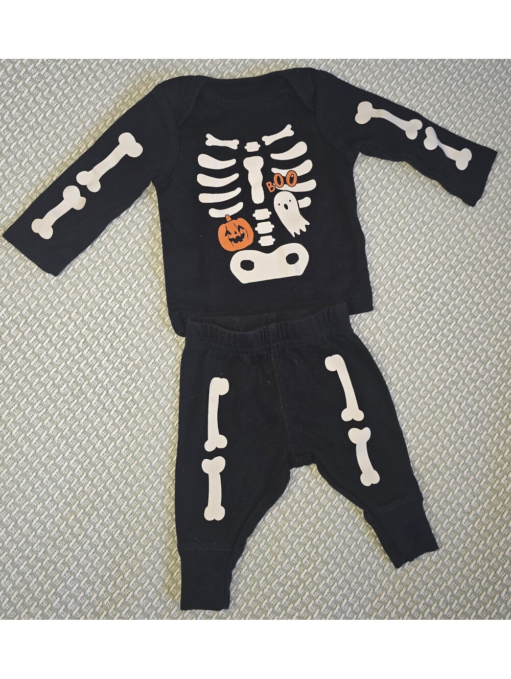 Newborn Carter's skeleton two-piece outfit with pumpkin